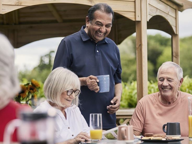 a group of people sitting at a table