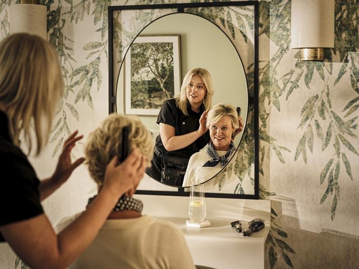 a person taking a selfie in a mirror