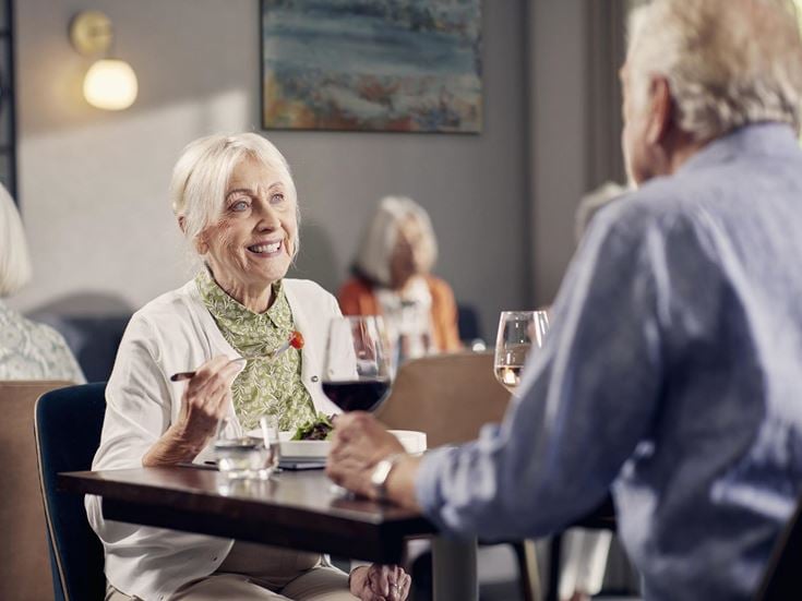 a woman and a man having a conversation
