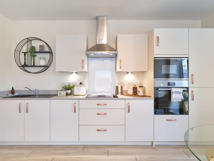 a kitchen with white cabinets