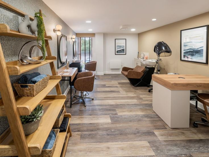 a room with a staircase and a desk