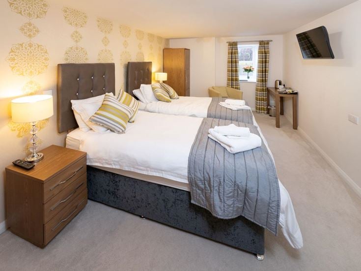 a bed with a white blanket