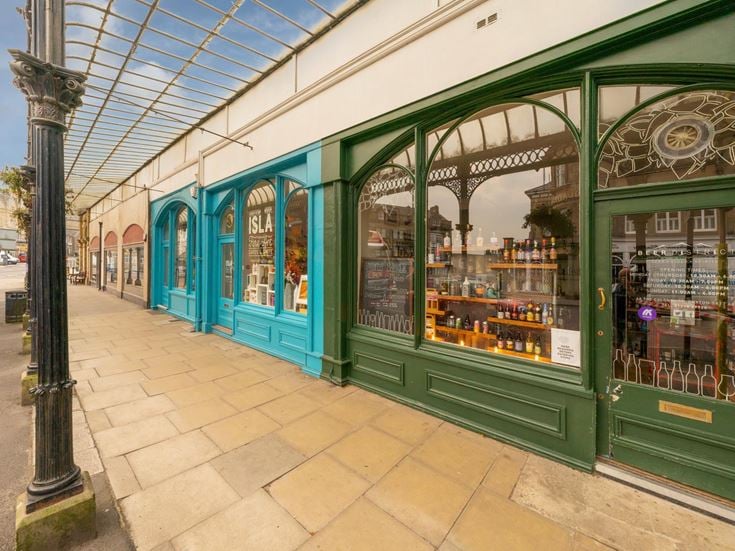 Row of shops in Cavendish Arcade in Buxton, Derbyshire.
