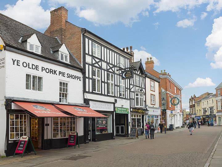 a street with buildings and people