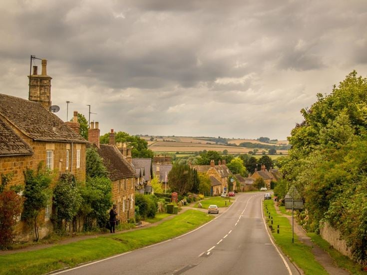 A road lined with cottages in the village of Rockingham, Northamptonshire.