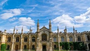 A green lawn in front of a historic Cambridge University building in Cambridgeshire.