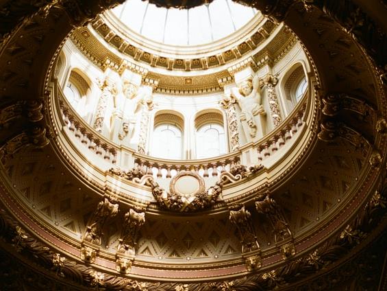 A marble dome inside the Fitzwilliam Museum, with a glass top.