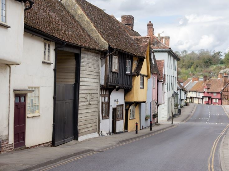 Multicolored cottages on a street in Saffron Walden, Essex.