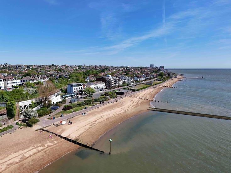 The beach with houses overlooking the sea at Westcliff-on-Sea.