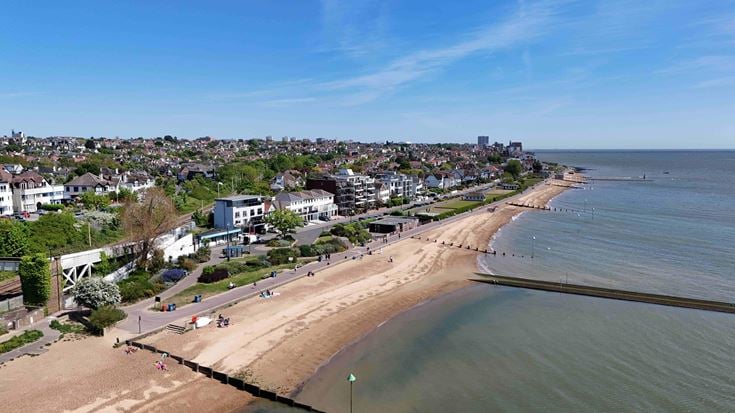 The beach with houses overlooking the sea at Westcliff-on-Sea.