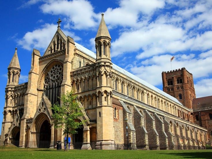 The Cathedral in St Albans, set against a blue sky with a few clouds.
