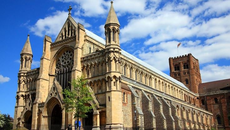 The Cathedral in St Albans, set against a blue sky with a few clouds.