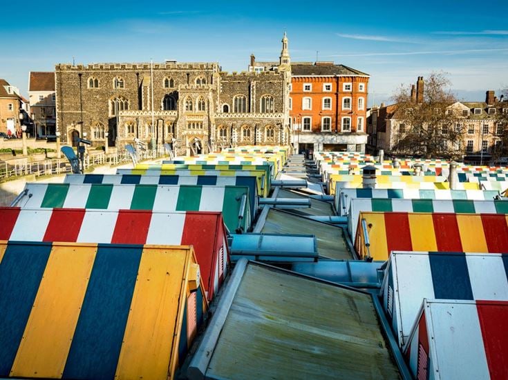A row of multicoloured rooftops in Norwich market.