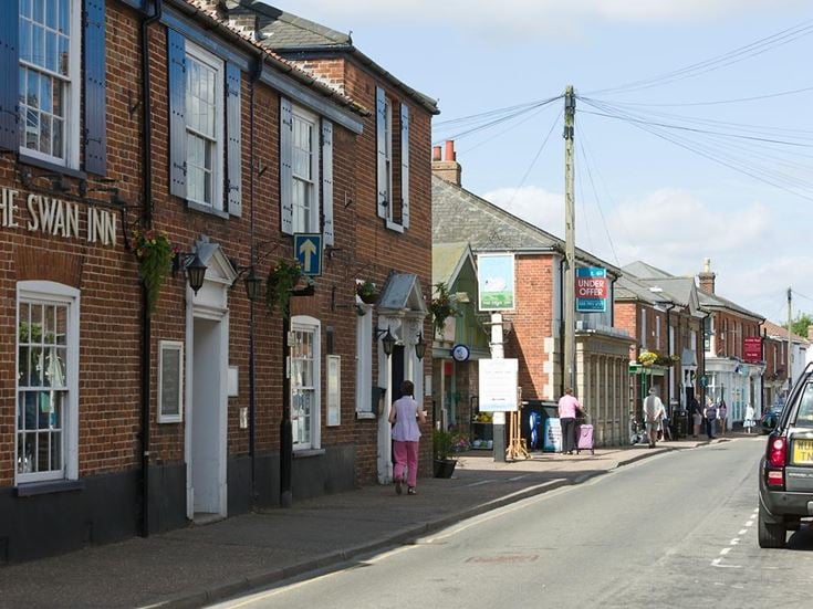 a street with buildings and people
