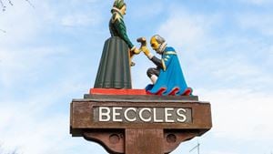 a statue of a man and woman holding hands on a pole