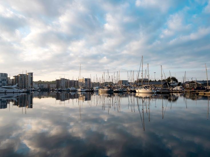 A dock full of sailboats at the iconic Waterfront in Ipswich.