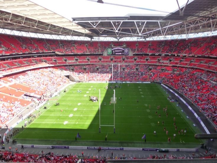Wembley Stadium with spectators watching a rugby match.
