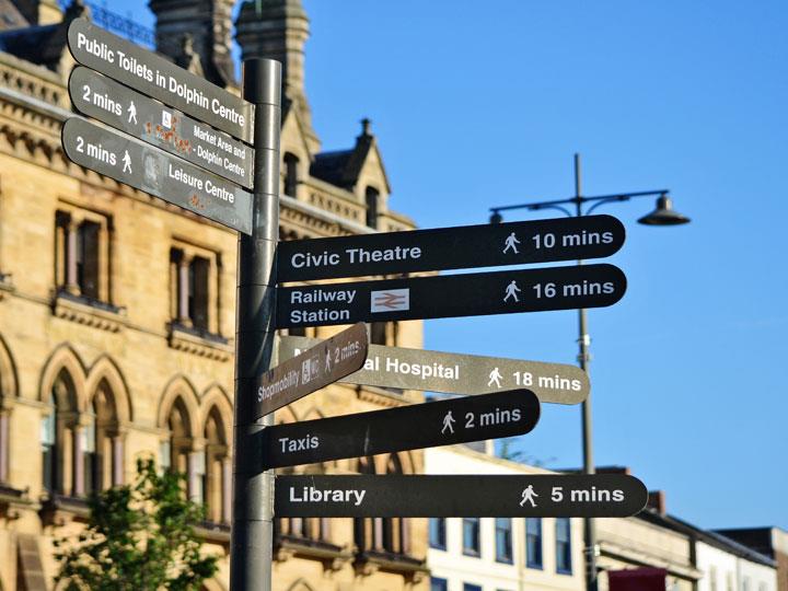 a street sign is posted on a pole