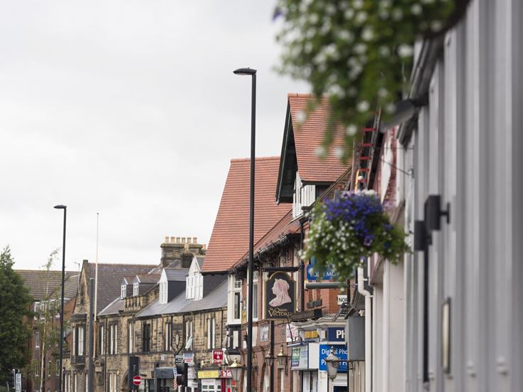 A street with shops and cafes in Gosforth, Newcastle-upon-Tyne