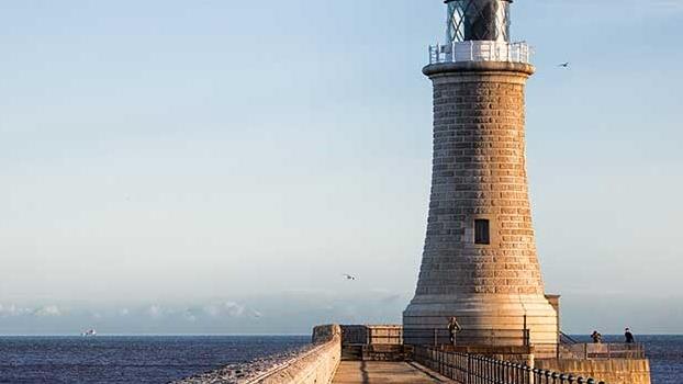 a lighthouse on a pier