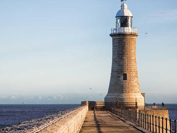 a lighthouse on a pier