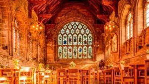 he interior of Chester Cathedral, lit with an amber glow.