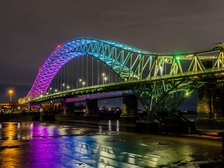 a bridge with lights at night