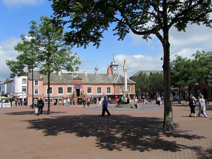 Historic high street in Carlisle with independent shops and traditional architecture