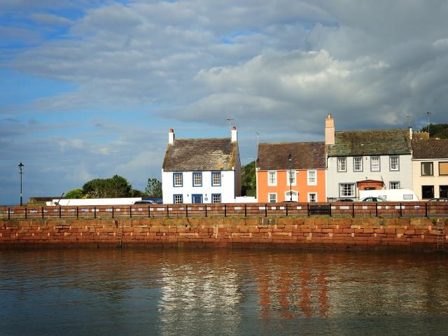 A row of old houses along Maryport Harbour, Cumbria.