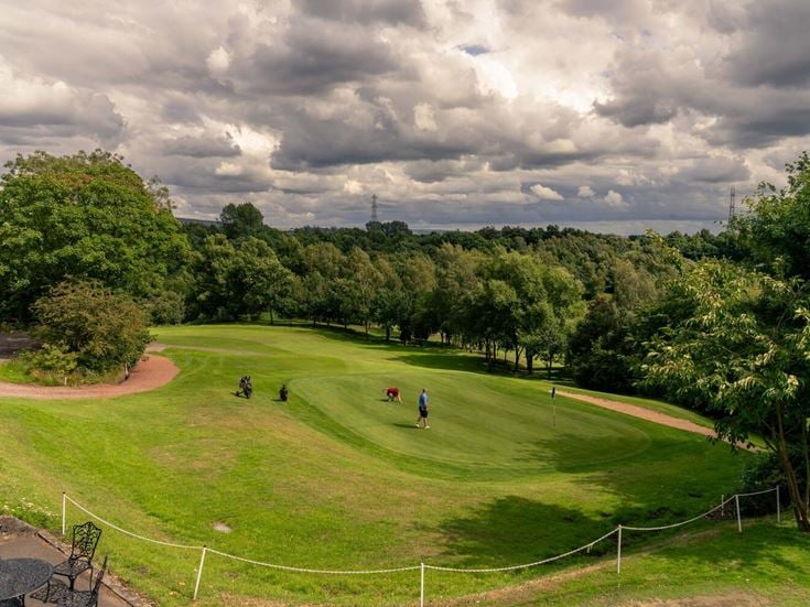 Two people enjoying a round of golf at Brookdale Golf Club.