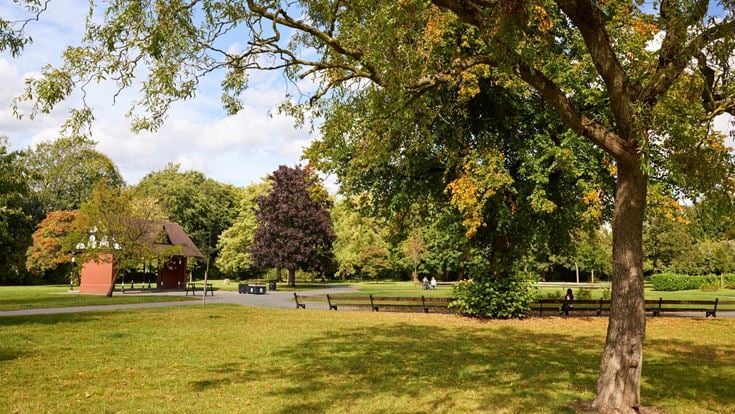 Cale Park in Davenport featuring mature trees, seating and level footpaths.