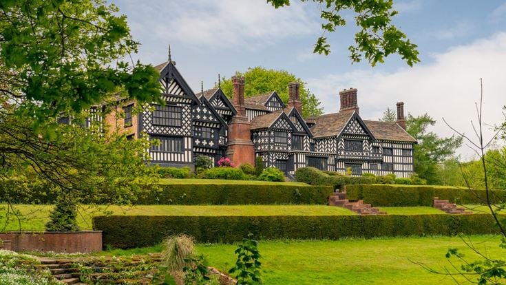 View from a lawn of Bramall Hall Tudor manor house.