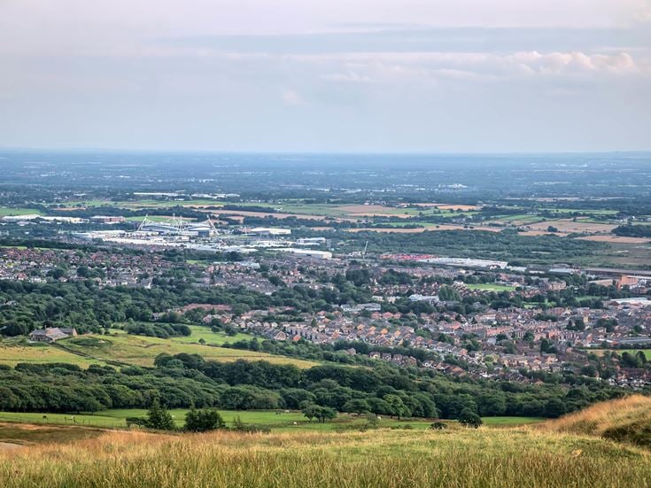 a landscape with trees and buildings