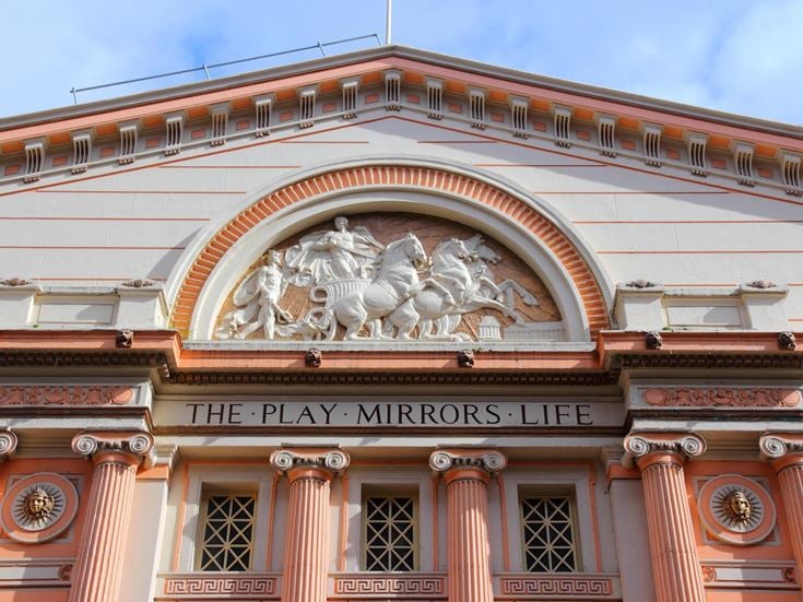 The decorative exterior stonework of Manchester Opera House.