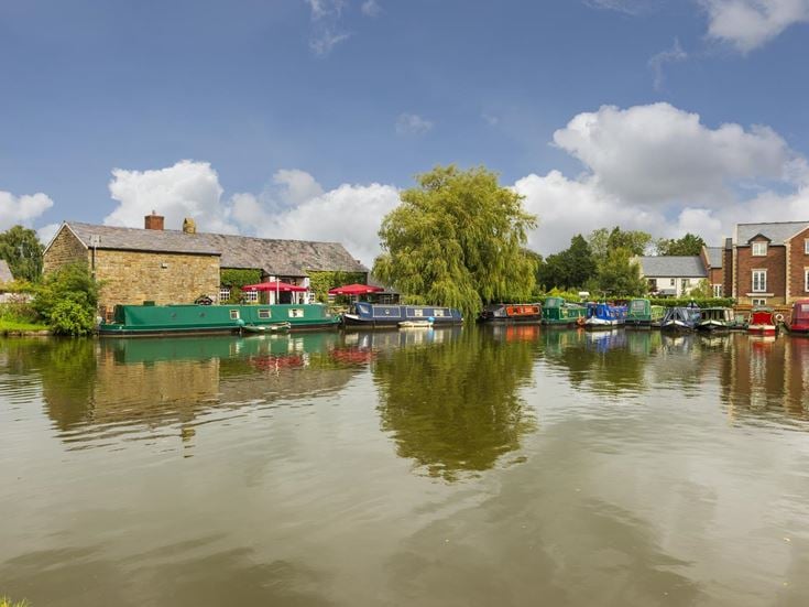 A row of canal boats in a small town in Lancashire.