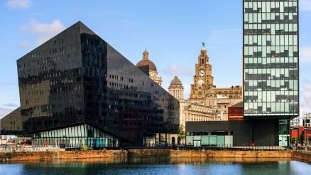 a body of water with buildings along it