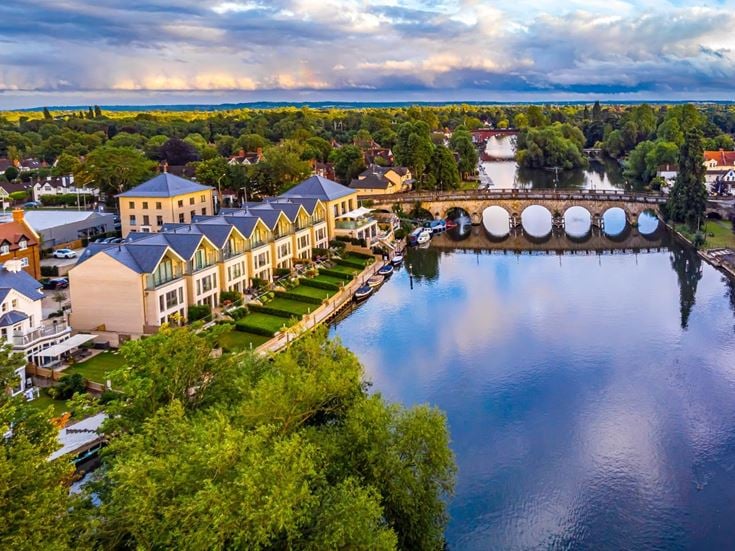 Aerial view of the River Thames and Maidenhead Bridge, buildings and surrounding greenery in Maidenhead.