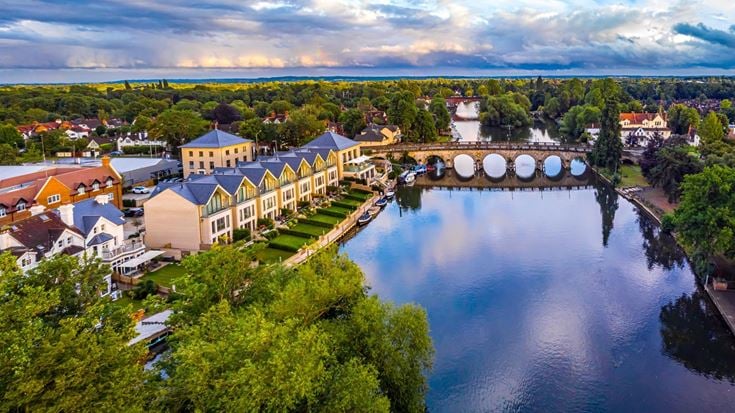 Aerial view of the River Thames and Maidenhead Bridge, buildings and surrounding greenery in Maidenhead.
