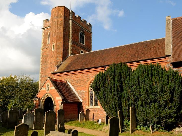 The red brick St Peters church in Chalfont St Peter.