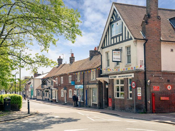The corner of a street with a row of shops in Great Missenden.