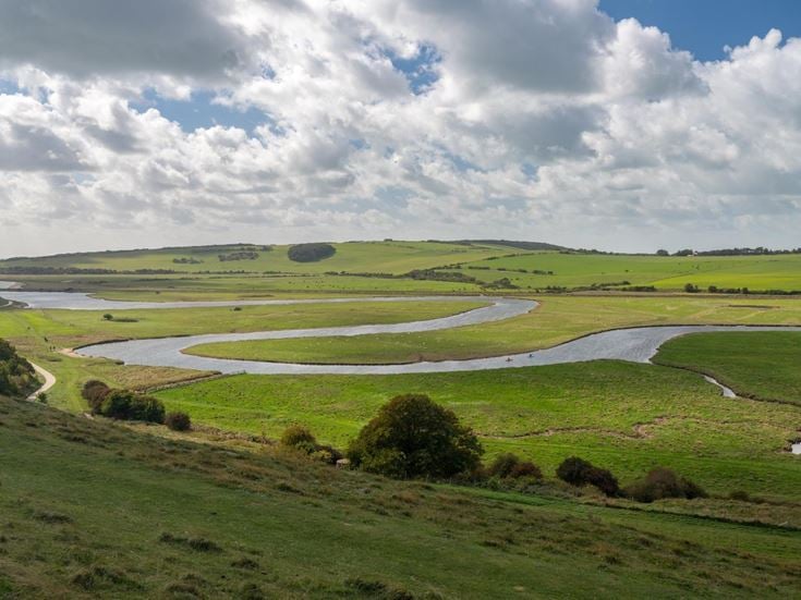 The meandering River Cuckmere as it flows through the flood plains of Cuckmere Haven in East Sussex.