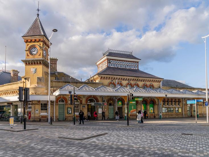The Eastbourne railway station building that features a clock tower.