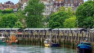 A row of fishing boats docked along the river in Rye.