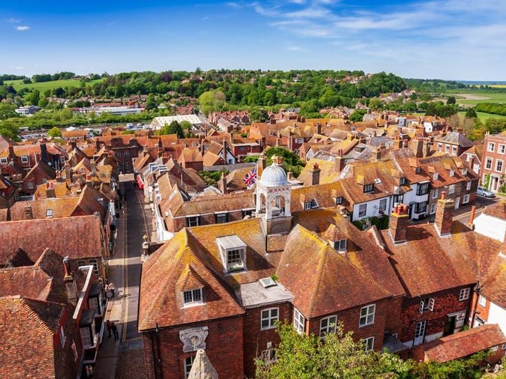 An aerial view of the Rye townscape, with rolling hills in the background.