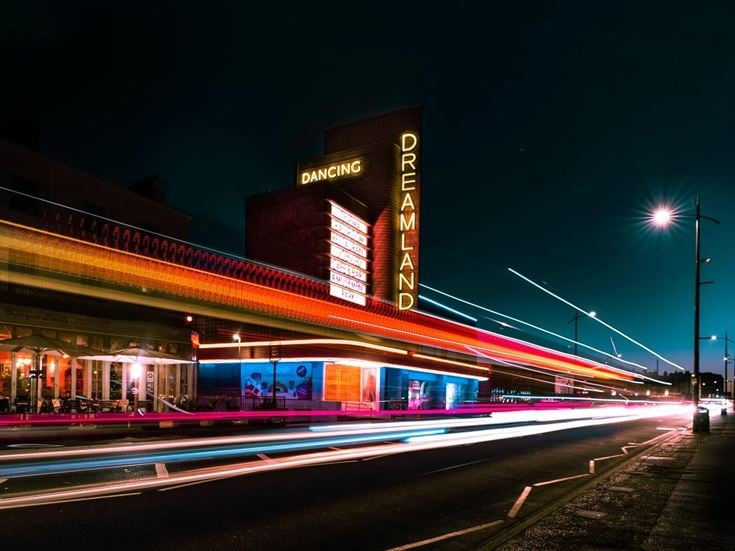 Vehicle light trails outside of Dreamland.