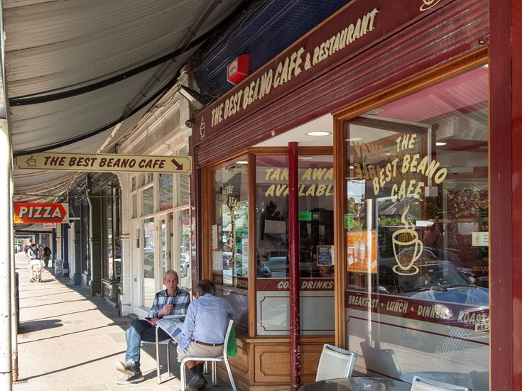 A row of cafes, shops, and a pizzeria in Westgate-on-Sea.