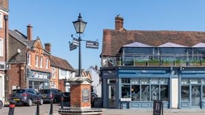 A view of Bagshot town centre with restaurants in the background.