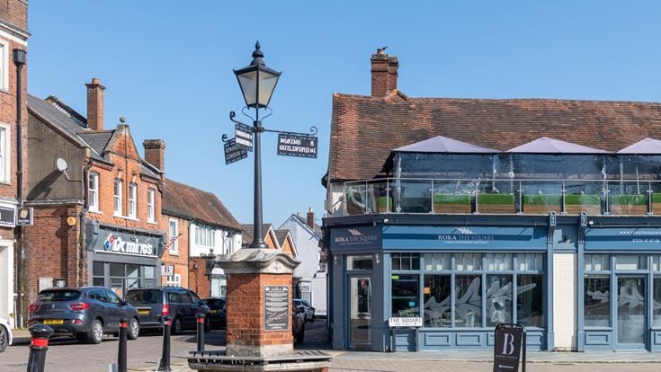 A view of Bagshot town centre with restaurants in the background.