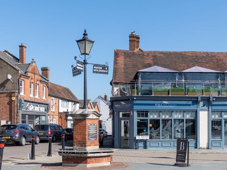 A view of Bagshot town centre with restaurants in the background.