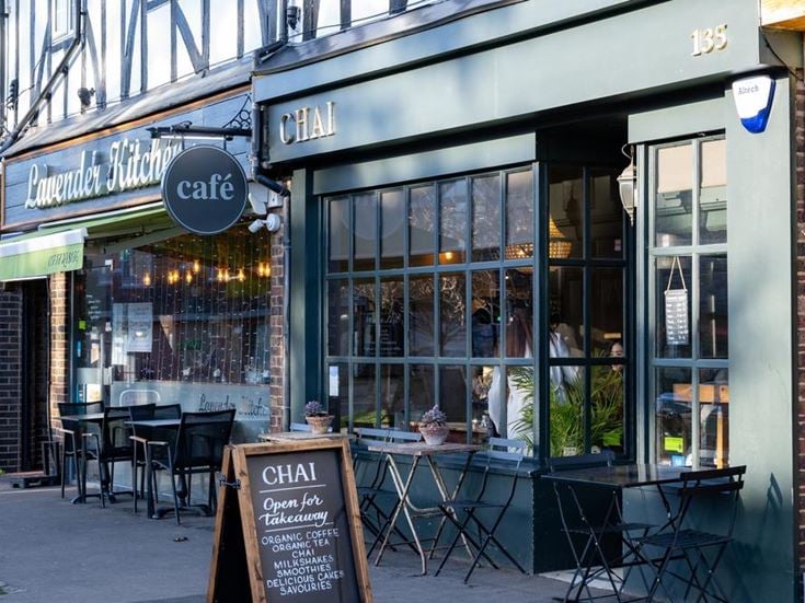 a restaurant with tables and chairs outside
